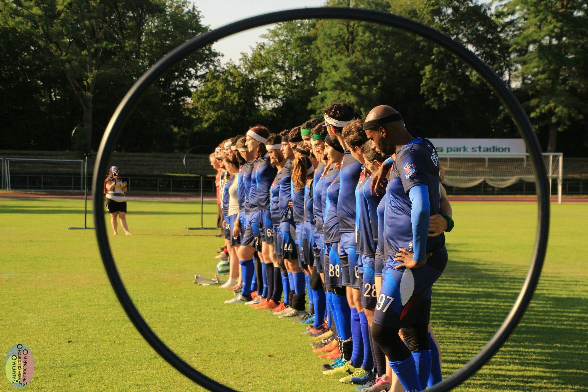 Team France lined up, photo through hoop