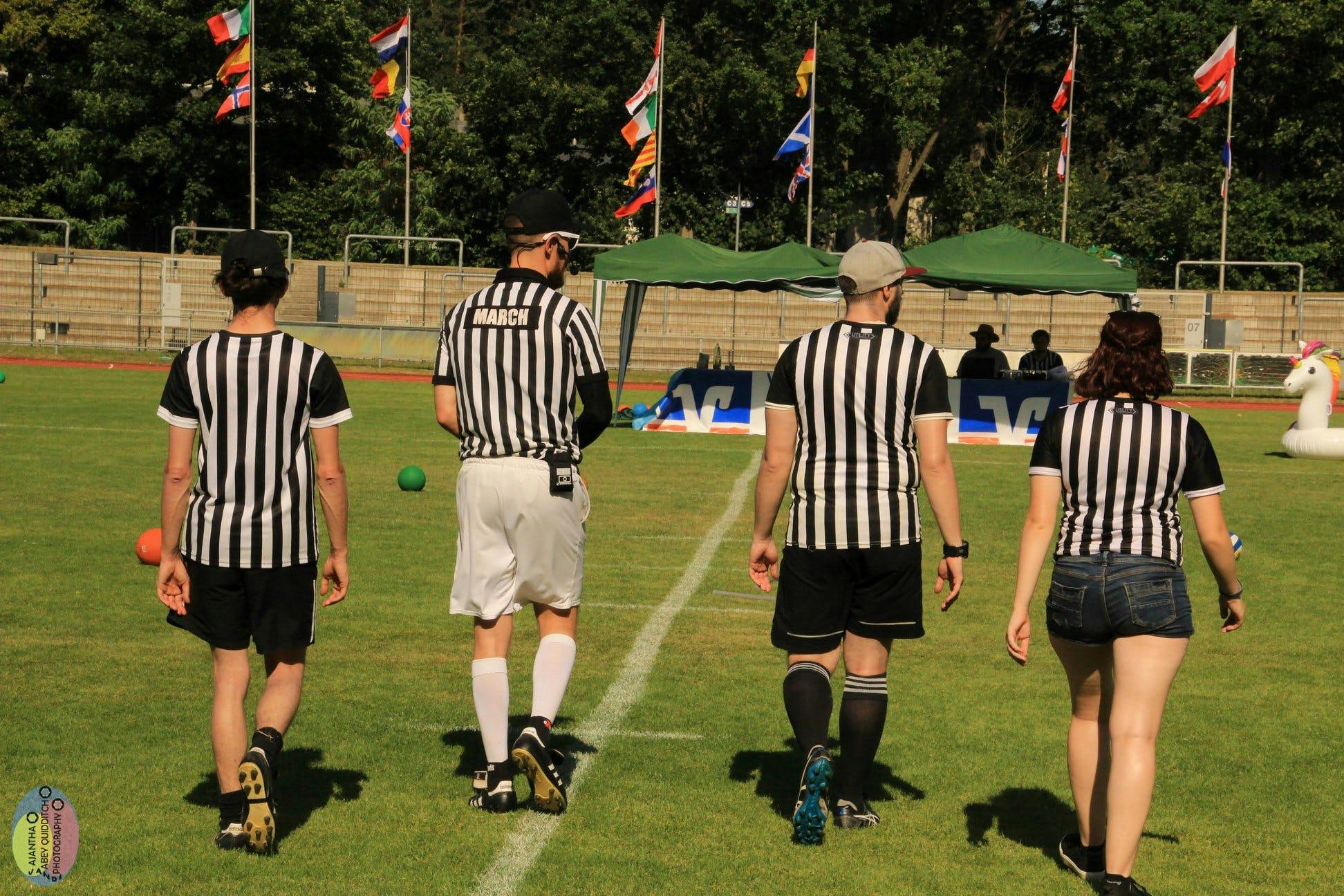 4 referees walking to scoretable